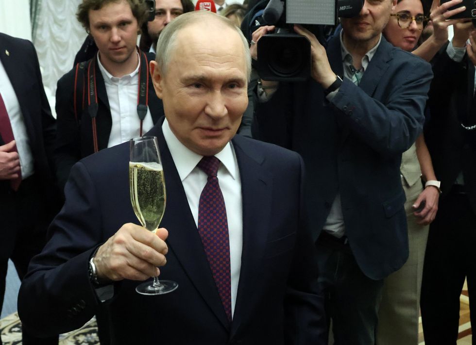 Putin with a glass of champagne