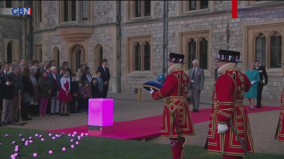 Queen laughs at 'cheeky' joke during video call with Australians of the Year