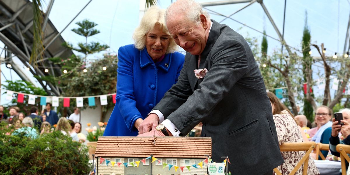 Queen Camilla and King Charles team up to cut cake with a sword in Cornwall Queen Camilla and King Charles team up to cut cake with a sword in Cornwall