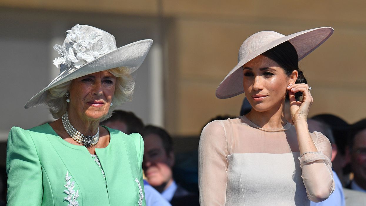 Queen Camilla left) the Duchess of Sussex at a garden party at Buckingham Palace
