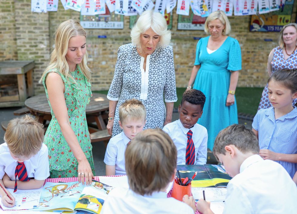 Queen Camilla meets schoolchildren outdoors