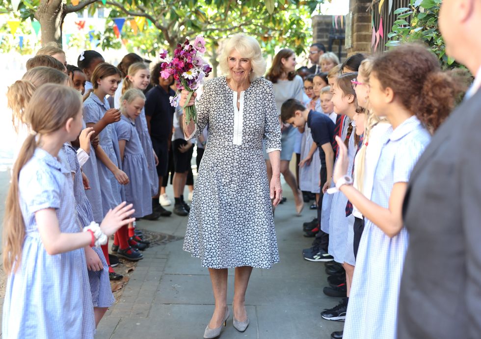 Queen Camilla with flowers from schoolchildren