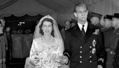 Queen Elizabeth II and her husband Prince Philip, Duke of Edinburgh, leave Westminster Abbey after the wedding ceremony.