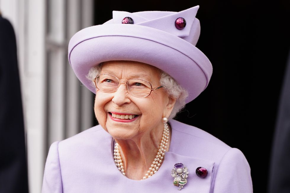 Queen Elizabeth II attends an armed forces act of loyalty parade in the gardens of the Palace of Holyroodhouse, Edinburgh, as they mark her platinum jubilee in Scotland. The ceremony is part of the Queen's traditional trip to Scotland for Holyrood Week. Picture date: Tuesday June 28, 2022.