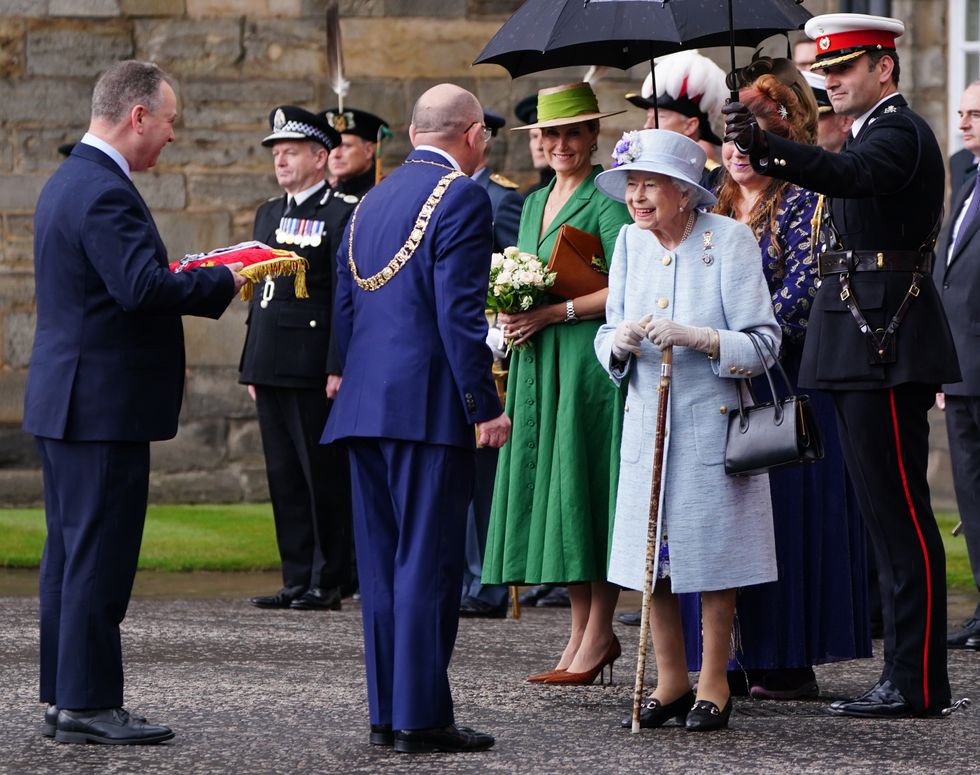 Queen Elizabeth II is greeted as she attends the Ceremony of the Keys on the forecourt of the Palace of Holyroodhouse in Edinburgh, accompanied by the Earl and Countess of Wessex, as part of her traditional trip to Scotland for Holyrood week. Picture date: Monday June 27, 2022.