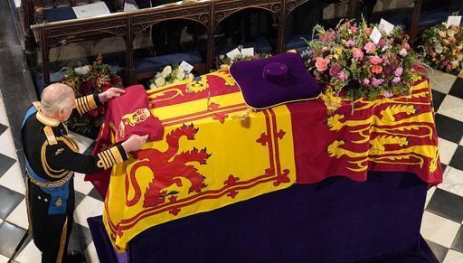 Queen Elizabeth II is lowered into the royal vault