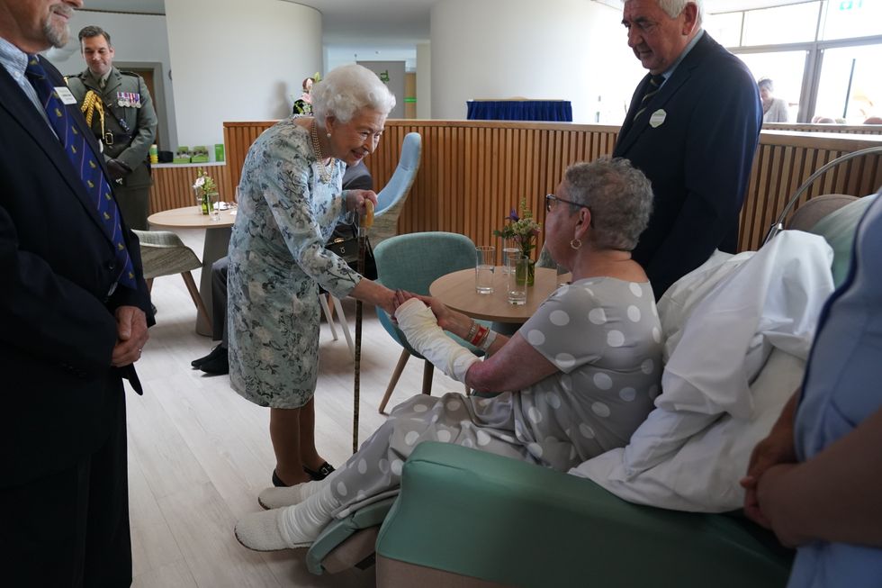 Queen Elizabeth II meeting patient Pat White during a visit to officially open the new building at Thames Hospice, Maidenhead, Berkshire. Picture date: Friday July 15, 2022.
