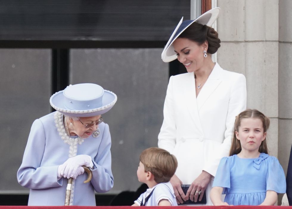 Queen Elizabeth II , Prince Louis, the Duchess of Cambridge, Princess Charlotte, on the balcony of Buckingham Palace.