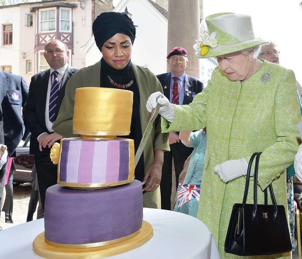 Queen Elizabeth II receives a birthday cake from Nadiya Hussain in 2016