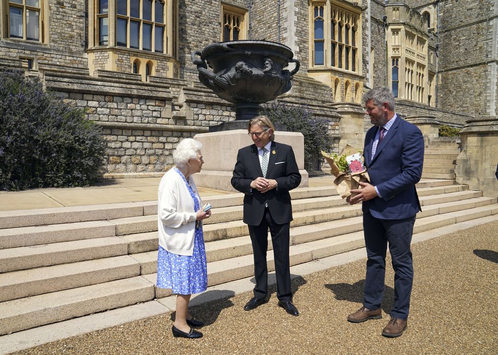 Queen Elizabeth II receives a Duke of Edinburgh rose, given to her by Keith Weed, President of the Royal Horticultural Society.