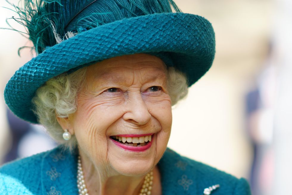 Queen Elizabeth II smiles during a visit to Manchester Cathedral.