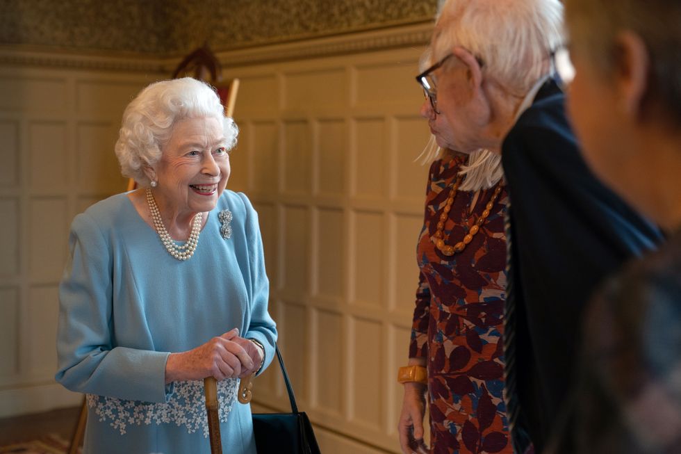 Queen Elizabeth II talks to members of the West Norfolk Befriending Society, during a reception in the Ballroom of Sandringham House, which is the Queen's Norfolk residence, to celebrate the start of the Platinum Jubilee. Picture date: Saturday February 5, 2022.