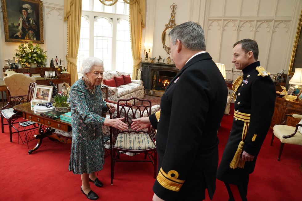 Queen Elizabeth II with Rear Admiral James Macleod (right) and Major General Eldon Millar as she meets the incoming and outgoing Defence Service Secretaries during an in-person audience at Windsor Castle. Rear Admiral Macleod relinquished his appointment as Defence Services Secretary as Major General Millar assumed the role. Picture date: Wednesday February 16, 2022.