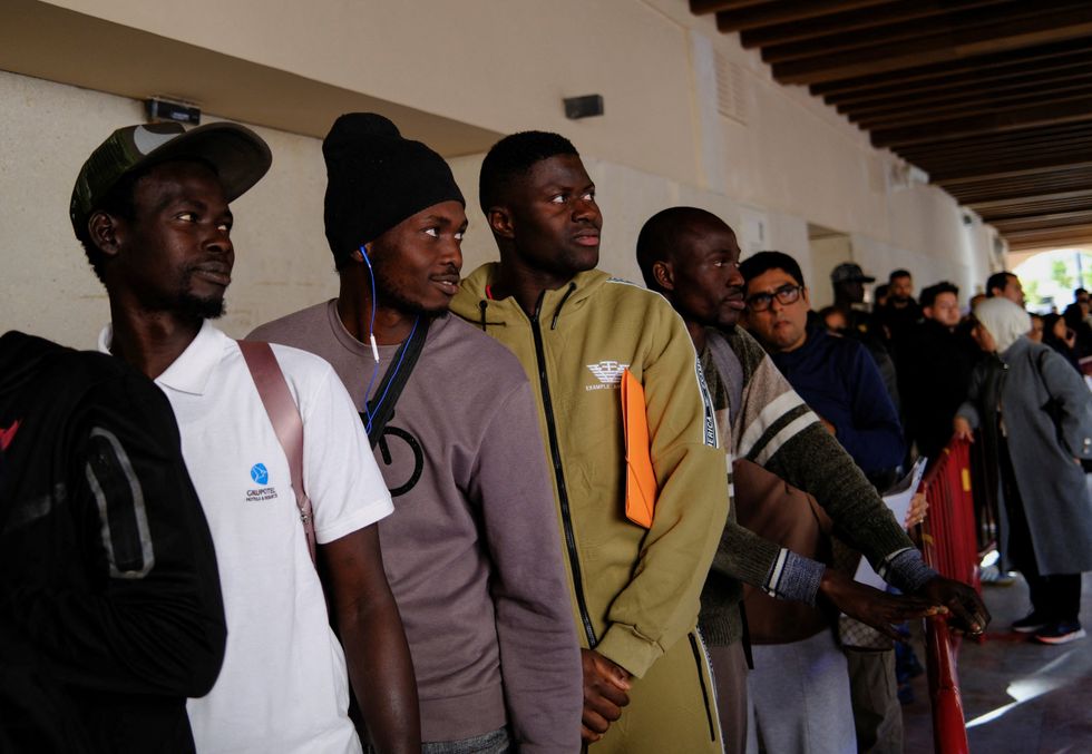 Queue of migrants at registry office in Almeria