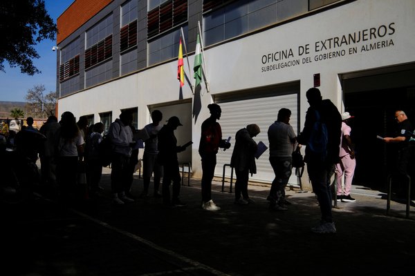Queue of migrants at registry office in Almeria