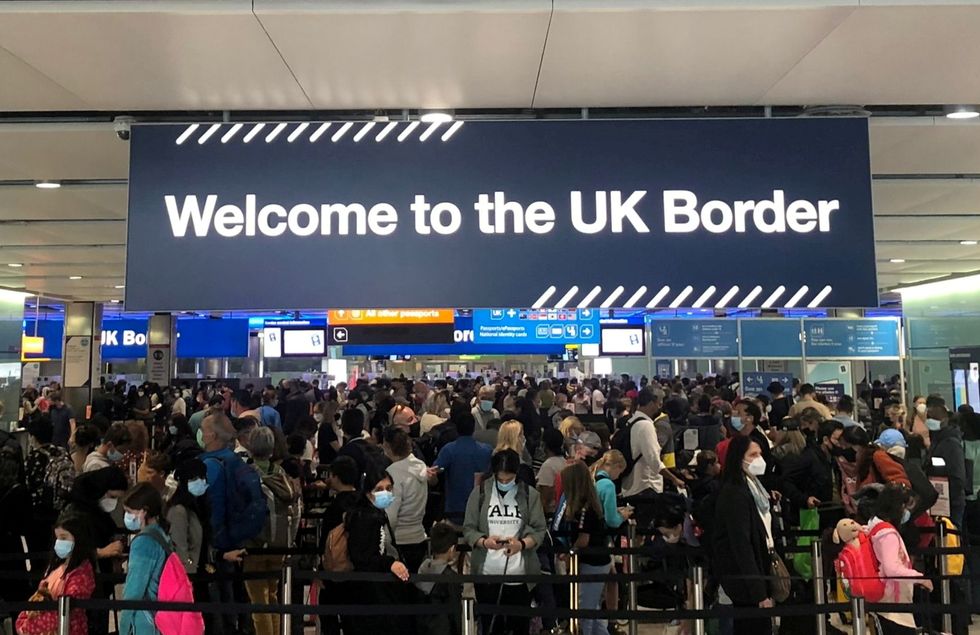 Queues of people wait in line at U.K. citizens arrivals at Heathrow Airport in London