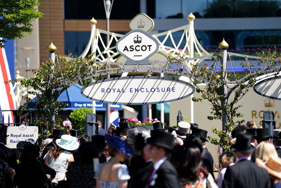 Racegoers arriving at the Royal Enclosure ahead of day one of Royal Ascot at Ascot Racecourse. Picture date: Tuesday June 14, 2022.