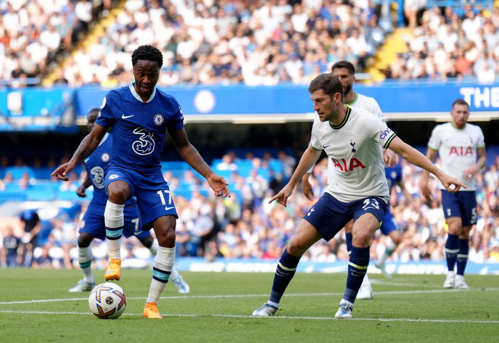 Raheem Sterling battles with Tottenham Hotspur's Ben Davies during the Premier League match at Stamford Bridge