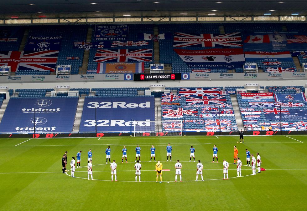 Rangers and Hamilton Academical players observe a minute's silence before their Scottish Premiership match without fans. Nicola Sturgeon has confirmed sport will 'effectively' become 'spectator free.'