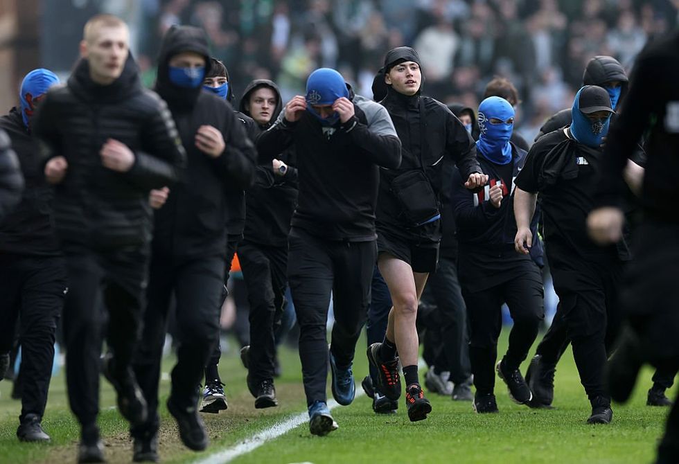 Rangers ultras broke onto the pitch after Celtic fans did the same following their penalty shootout win
