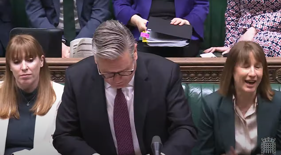 Rayner, who flanked Starmer alongside a chuckling Reeves, looked on blankly.