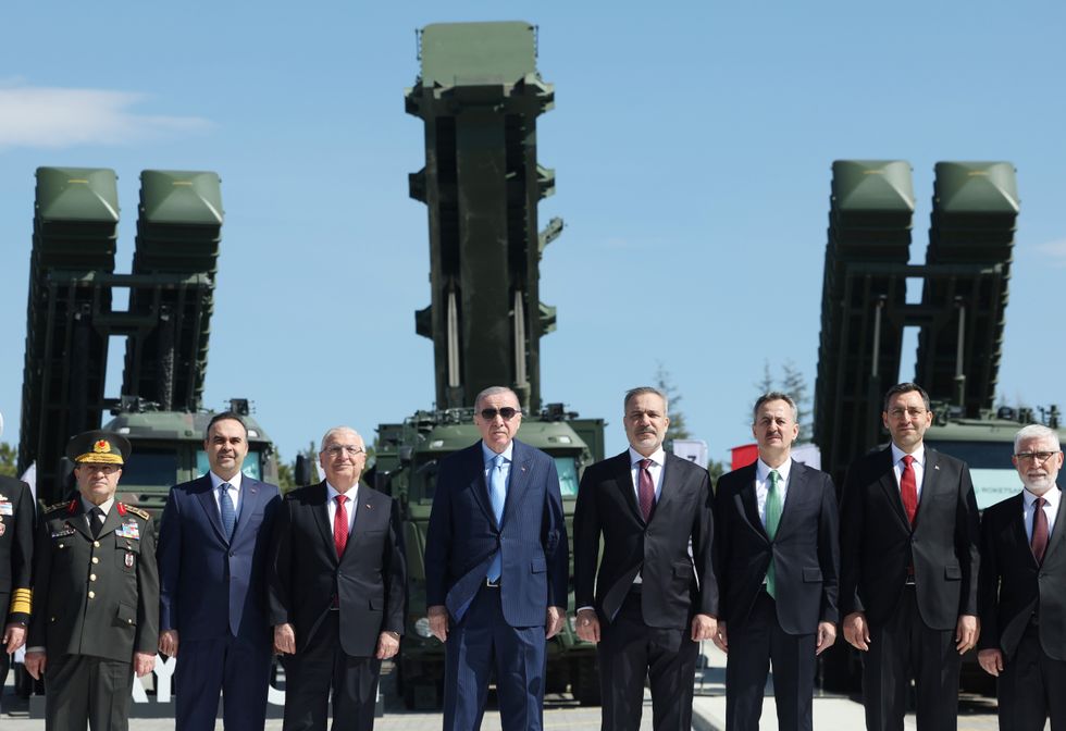 Recep Tayyip Erdogan standing in front of Turkish missiles