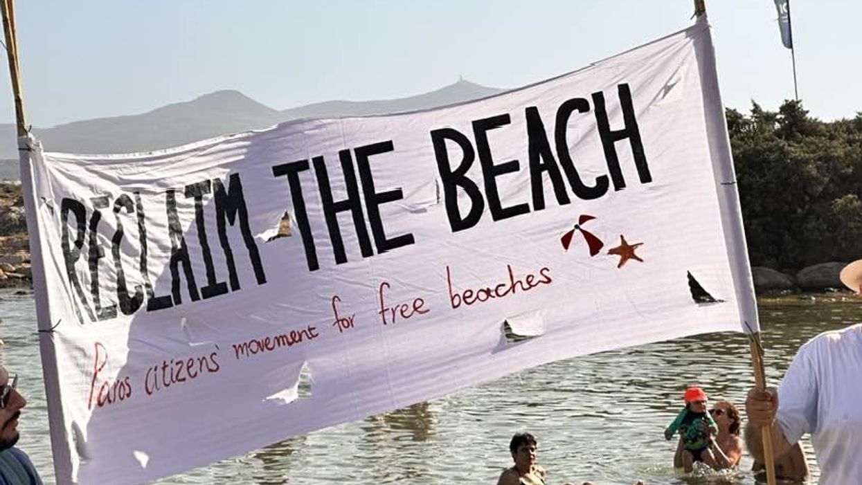 Reclaim the beach sign