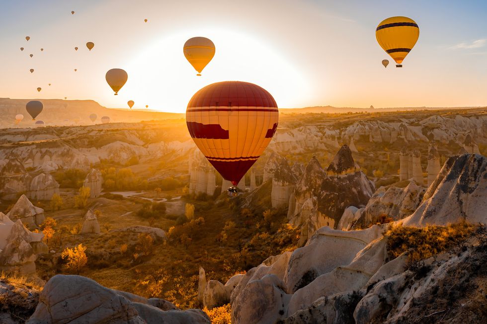 Red and yellow hot air balloons at Love Valley in Cappadocia, Turkey