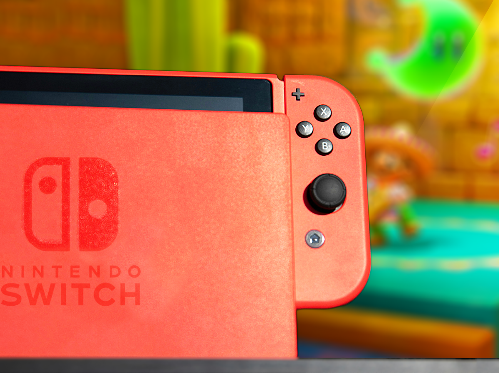 red nintendo switch console in the dock with a television showing mario odysessy in the backfground