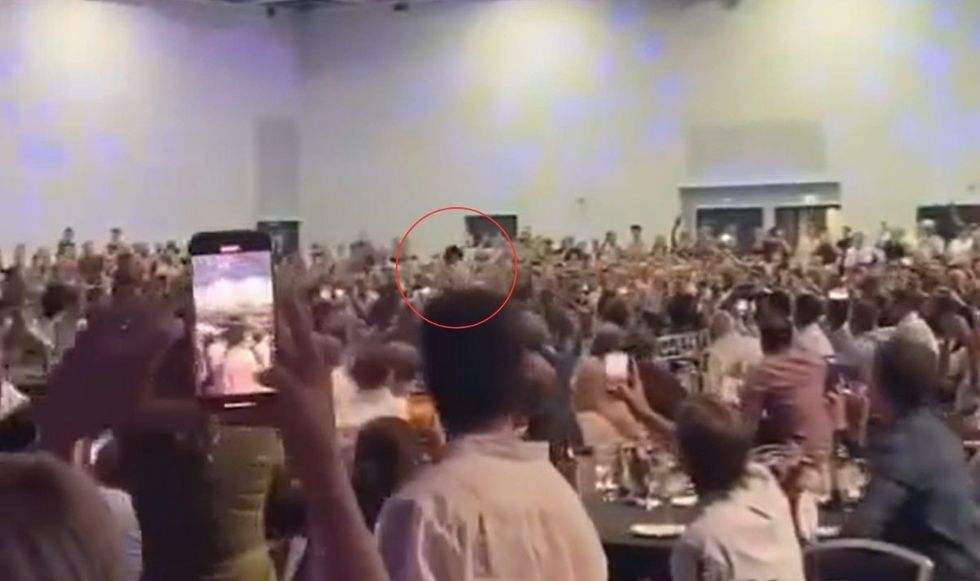 Reece Walsh caught the ball while running through the group of people