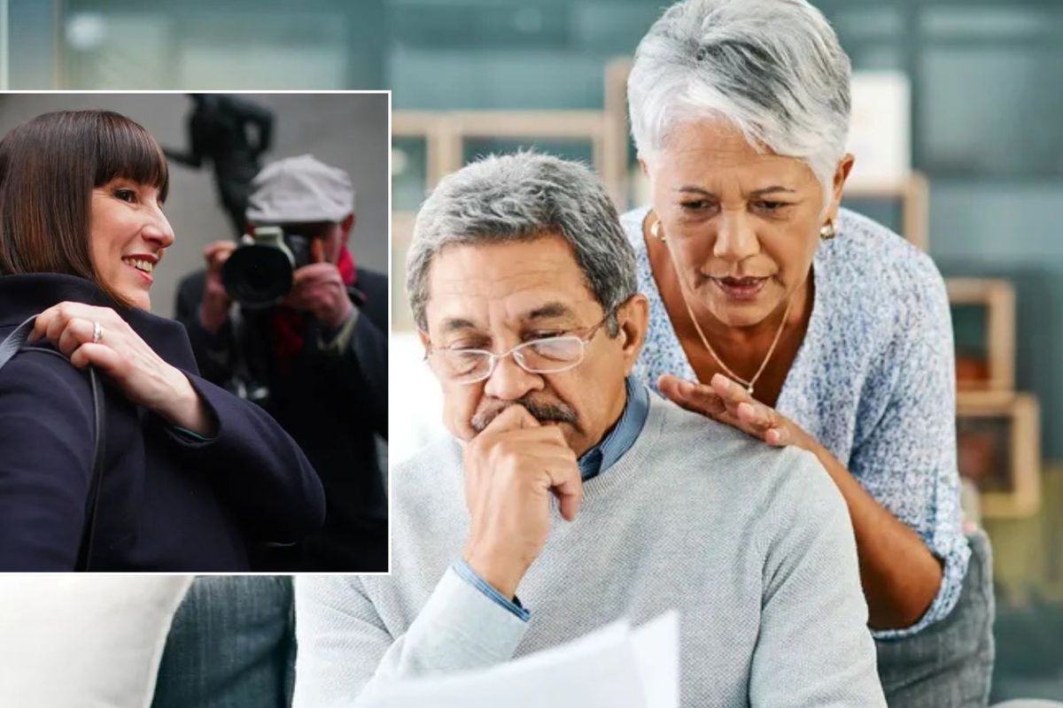 Reeves and couple looking at bill