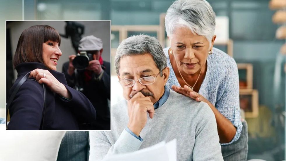 Reeves and couple looking at bill