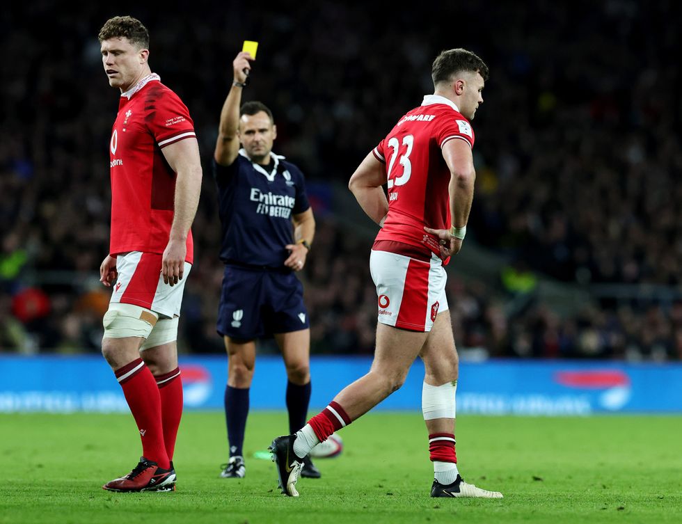 Referee James Doleman shows a yellow card to Mason Grady of Wales during the Guinness Six Nations 2024 match