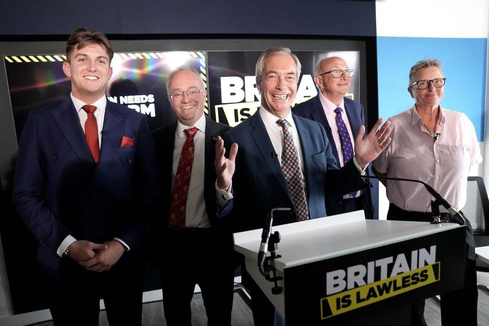 Reform party leader Nigel Farage and (left to right) the leader of Warwickshire County Council, Reform's George Finch, the police and crime commissioner for Leicestershire, Rupert Matthews, Reform UK policing and crime advisor, Colin Sutton and Reform UK's new justice adviser and former prison governor Vanessa Frake
