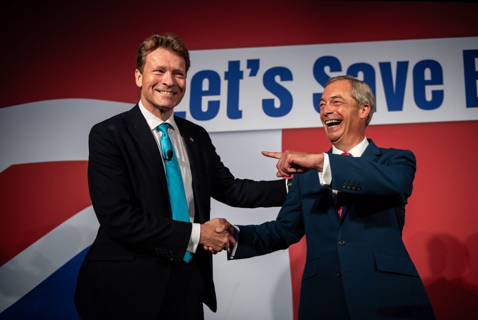 Reform Party leader, Richard Tice, and founding member, Nigel Farage, on stage at the Reform Party annual conference on October 7, 2023