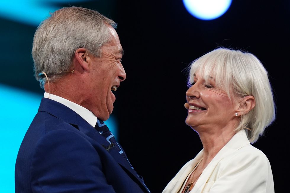 Reform UK leader Nigel Farage and former high-profile Conservative Nadine Dorries, who defected to Reform UK on the eve of its party conference, during the party's annual conference at the National Exhibition Centre in Birmingham