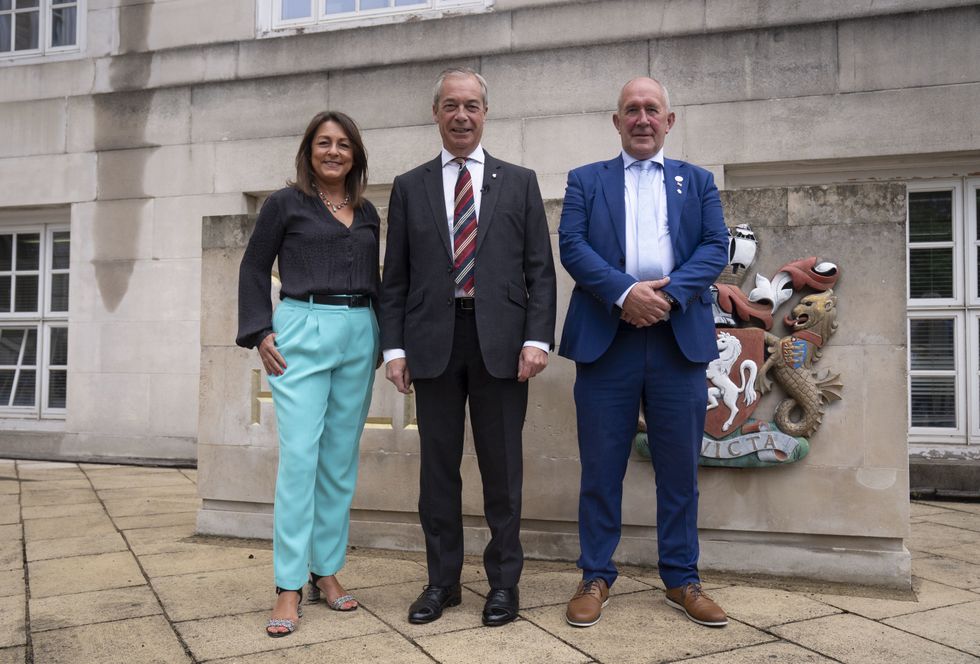 Reform UK leader Nigel Farage and (left to right) the Head of Kent County Council, Linden Kemkaran and councillor Brian Collins
