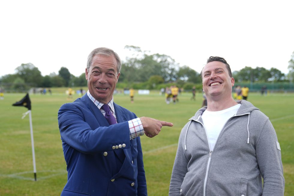 Reform UK leader Nigel Farage and the new Reform MP for South Basildon and East Thurrock, James McMurdock