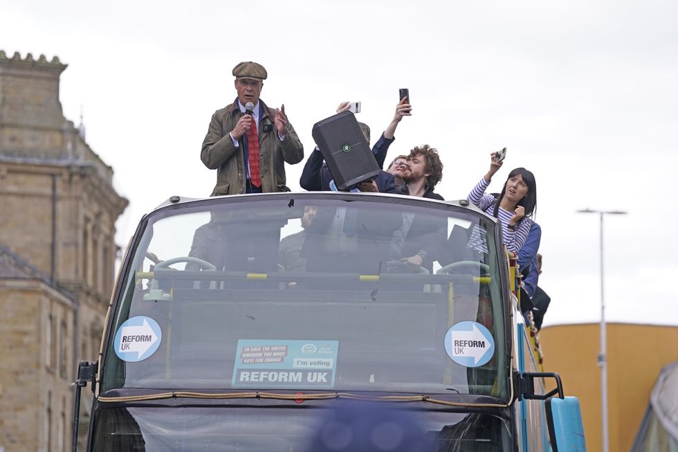 Reform UK leader Nigel Farage makes a speech on the Reform UK campaign bus in Barnsley, South Yorkshire