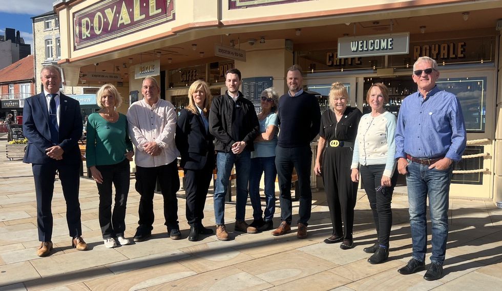 Reform UK members outside the Caffe Royale at Scarborough's South Bay