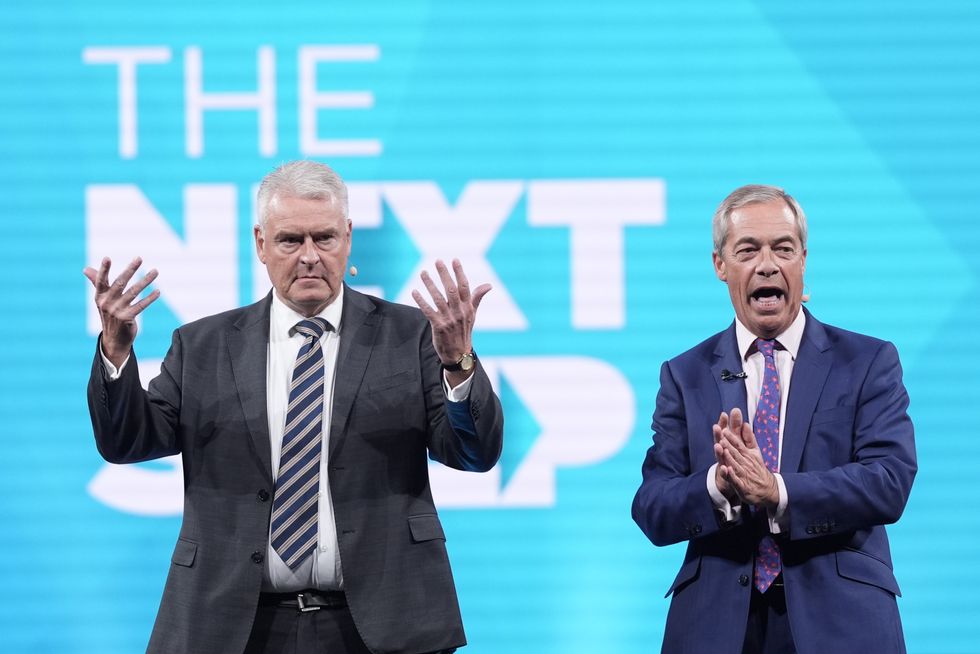 Reform UK MP for Ashfield, Lee Anderson (left) and Reform UK leader Nigel Farage on stage during the Reform UK party's annual conference at the National Exhibition Centre in Birmingham