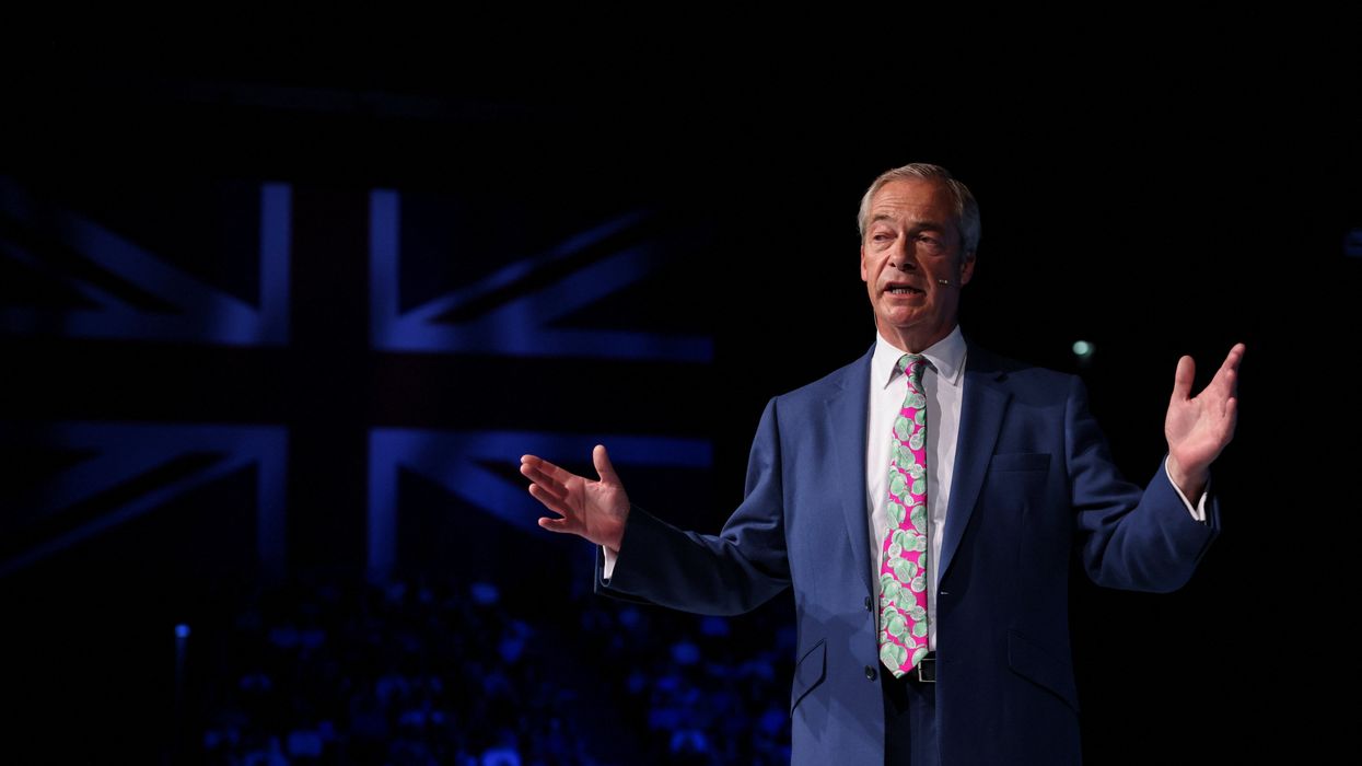 Reform UK Party Leader Nigel Farage delivers a speech during a rally at the NEC in Birmingham
