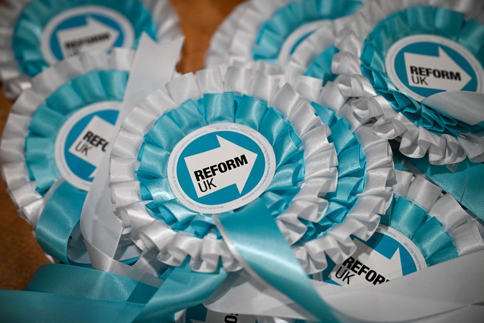 Reform UK rosettes are seen before the start of the conference at Westpoint Arena