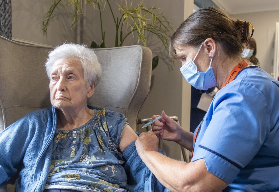 Registered Nurse Laura Hastings administers a covid booster to Agnes Taylor, 93, at Victoria Manor Care home in Edinburgh to launch the winter vaccine programme. Picture date: Monday September 5, 2022.
