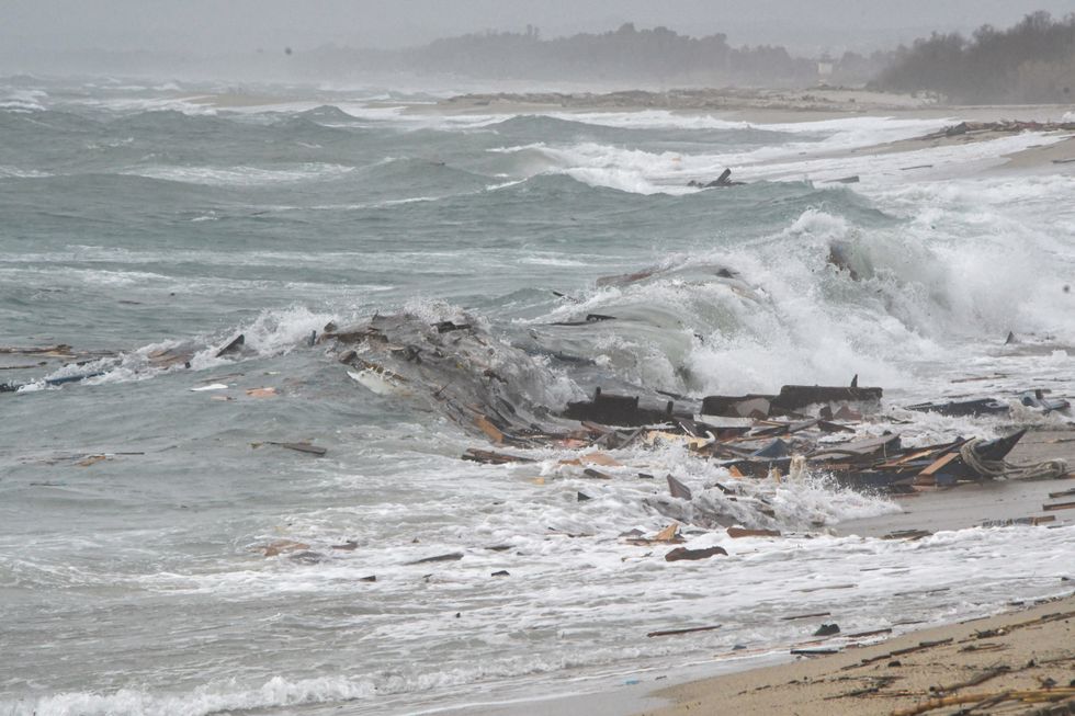 Remains of a ship are seen along the beach where bodies of suspected believed to be refugees were found after a shipwreck, in Cutro, the eastern coast of Italy\u2019s Calabria region, Italy, February 26, 2023. REUTERS/Giuseppe Pipita NO RESALES. NO ARCHIVES.