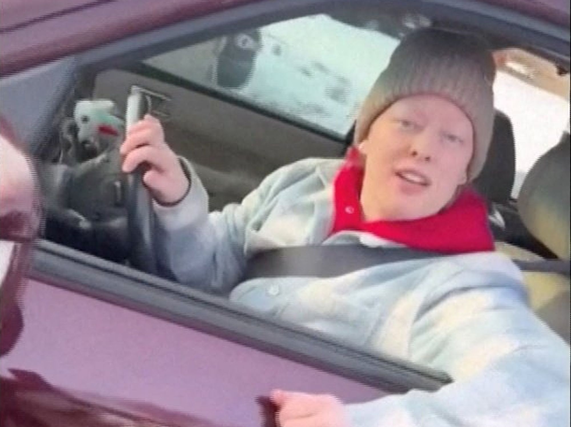 Renee Nicole Good leans out of a window after being confronted by Ice officers