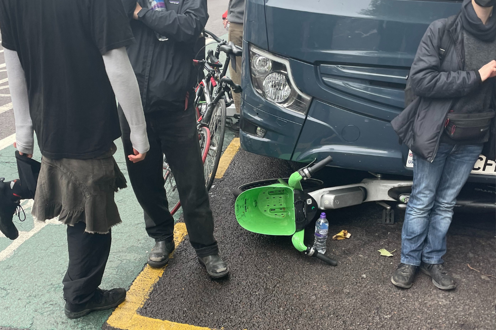 Rental scooter lodged under coach