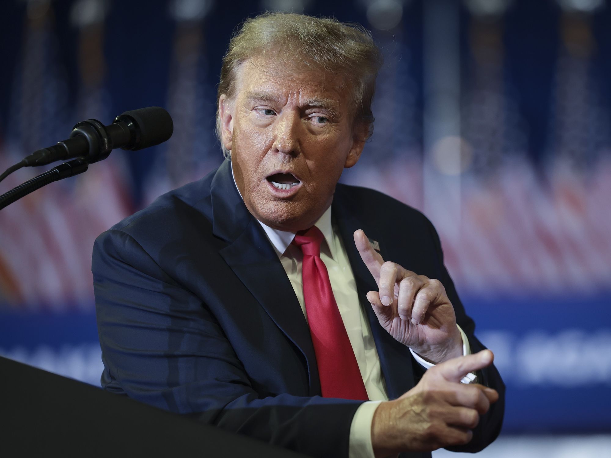 Republican presidential candidate and former President Donald Trump mocks U.S. President Joe Biden while speaking during a Get Out The Vote rally