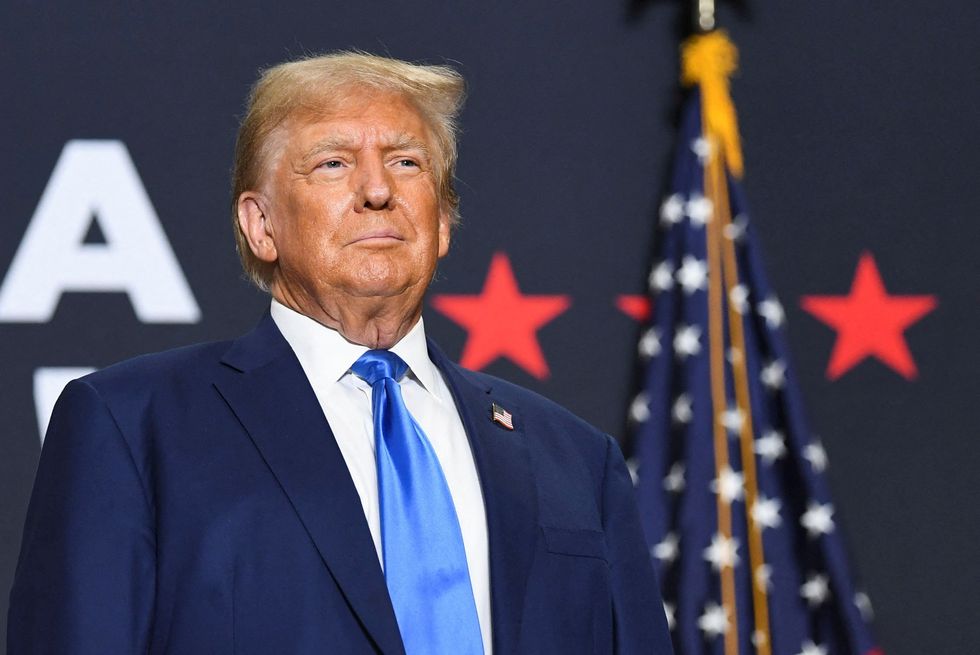 Republican presidential candidate and former U.S. President Donald Trump takes the stage for a campaign rally in Derry, New Hampshire