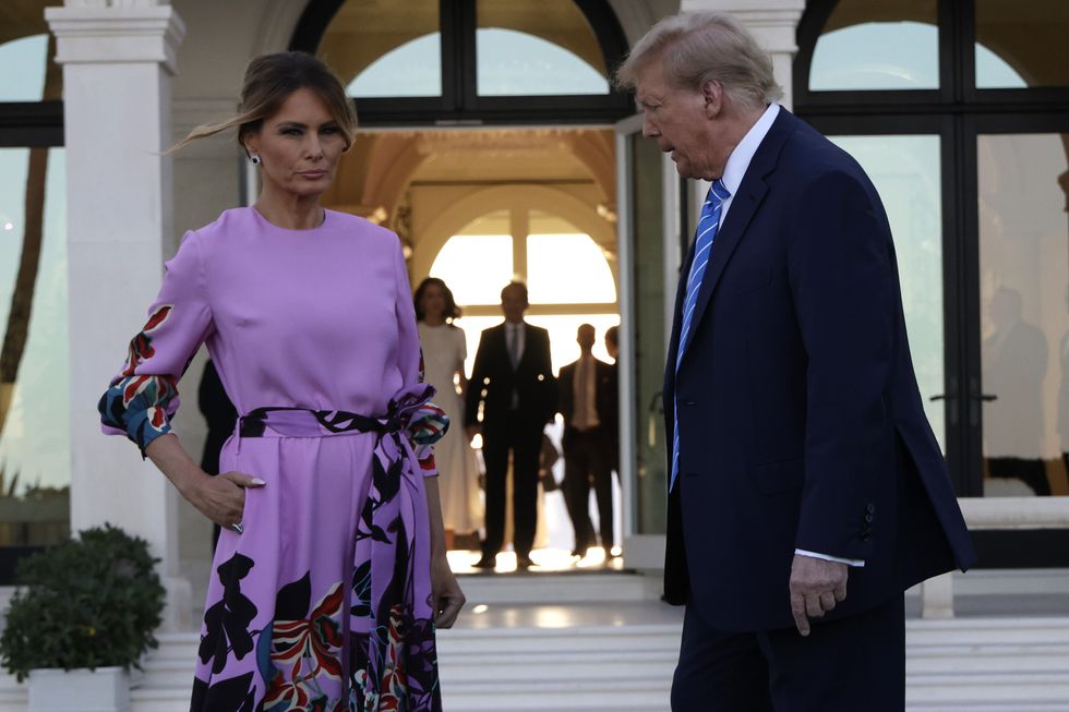 Republican presidential candidate, former US President Donald Trump and former first lady Melania Trump arrive at the home of billionaire investor John Paulson
